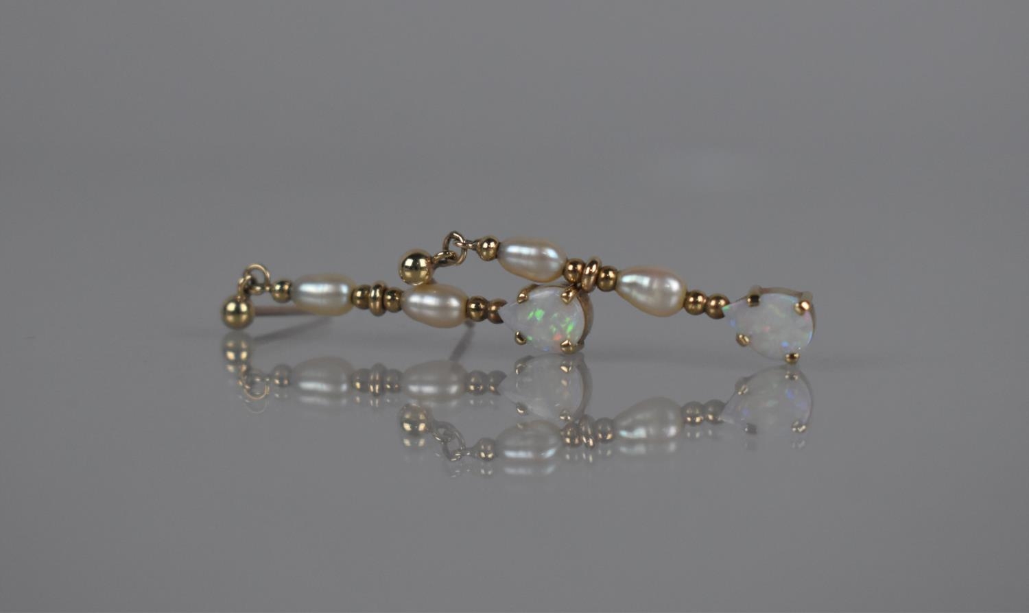 A Pair of 9ct Gold, Opal and Pearl Drop Earrings, Teardrop Opal Cabochon 7mm by 5mm Surmounted by