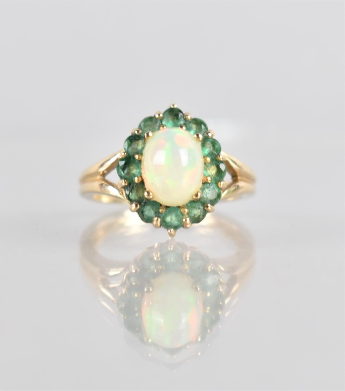 A 9ct Opal and Emerald Ladies Dress Ring, Central Oval Cabochon Stone Measuring 8x6mm in Four Claw