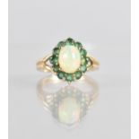 A 9ct Opal and Emerald Ladies Dress Ring, Central Oval Cabochon Stone Measuring 8x6mm in Four Claw