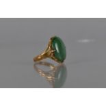 An Eastern 22ct Gold and Jade Cabochon Ring, Shallow Oval Cabochon Measuring 16mm by 11mm in a