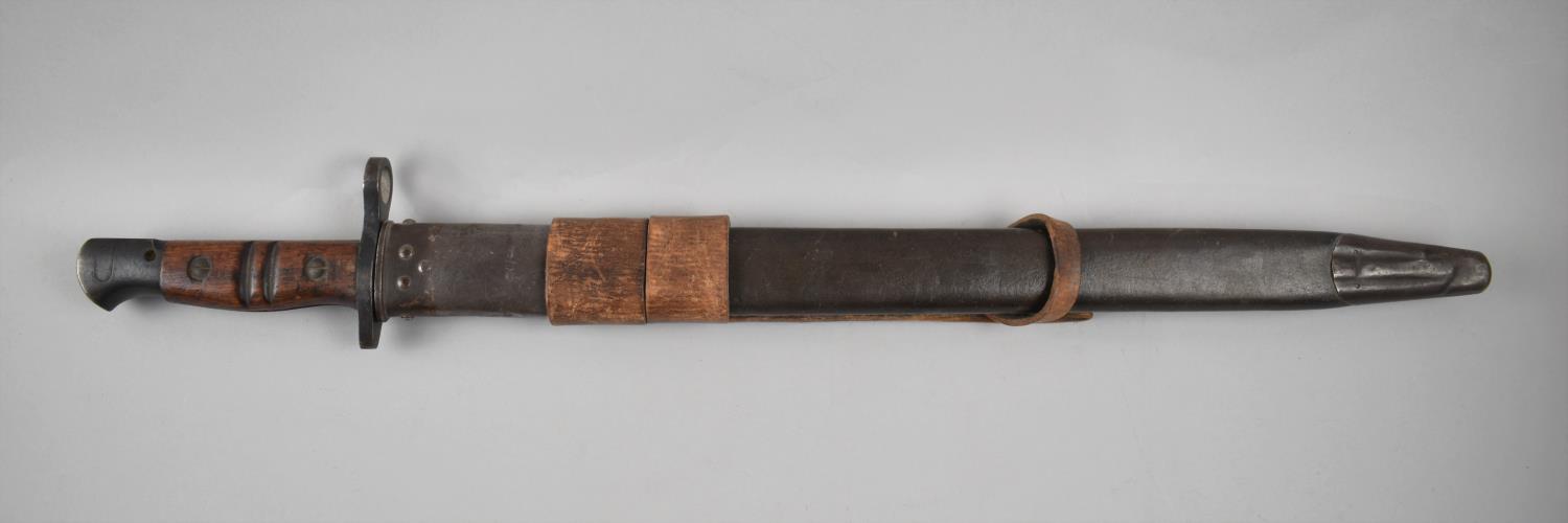 An American WWI 1917 Bayonet by Remington Stamped US and with Flaming Grenade, Grooved Wooden Slab