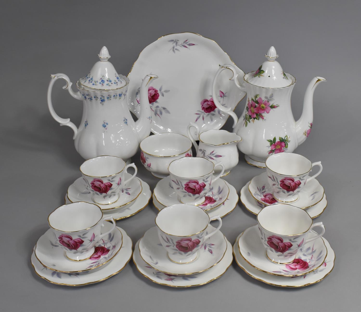 A Royal Albert Rose Pattern Tea Set to comprise Six Saucers, Six Cups, Side Plates, Sugar Bowl
