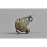 A Small Russian Jade and Silver Pendant in the Form of a Chick and Egg with Pink Eyes, 3cm high
