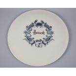 A Harrods Plate Decorated with Wreath of Fish, Croissant, Pineapples, Gammon, Pheasants, Pies,