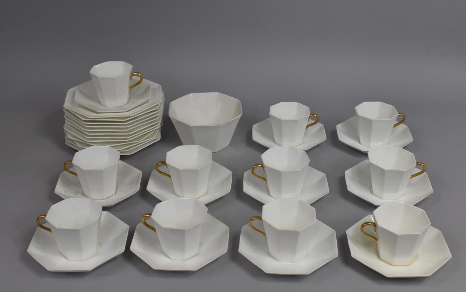A Wedgwood Gilt and White Decorated Service to comprise Cups, Saucers, Side Pates, Bowls, Cake Plate