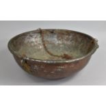 A Large and Heavy Hand Beaten North Indian Copper Hanging Bowl with Wrought Brass Mounts Hanging