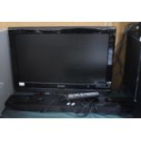 A Sharp 25" TV together with a Bush Sound Bar