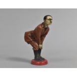 A Reproduction Cold Painted Desk Top Novelty Pin Cushion in the Form of Adolf Hitler Bending