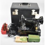 A Cased Electric Singer Sewing Machine