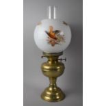 A Mid 20th Century Brass Oil lamp with Opaque Glass Shade Decorated with Pheasants, 48cms High