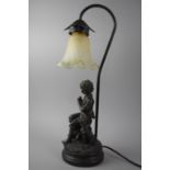 A Modern Resin Figural Table Lamp in the Form of Seated Boy with Dog, Opaque Glass Shade, 50cms High