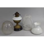 A Collection of Three Glass Oil Lamp Shades to include Frosted Moulded Example, together with a
