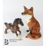 A  Beswick fireside figure of a seated fox marks to base Ht 31cms, model no.2348, together with a