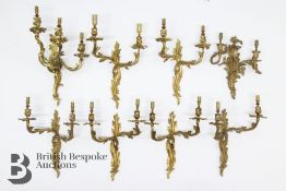 Eight Ornate Gilt Metal Wall Fittings