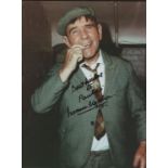 Norman Wisdom: Dedicated autograph on 10" x 8" colour photo.