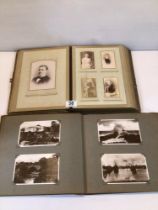TWO VINTAGE ALBUMS OF PHOTOGRAPHS AND POSTCARDS.