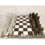VINTAGE COMPLETE AZTEC CHESS SET. IN MARBLE AND QUARTZ STONE ONYX BOARD AND PIECES.