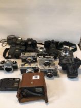 COLLECTION OF MIXED VINTAGE CAMERAS. INCLUDES NIKON, PENTAX, CANON, AND MORE.