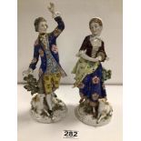 PAIR OF LATE 18TH CENTURY DERBY PORCELAIN FIGURES OF A LADY AND GENTLEMAN WITH DOGS, 26CM A/F