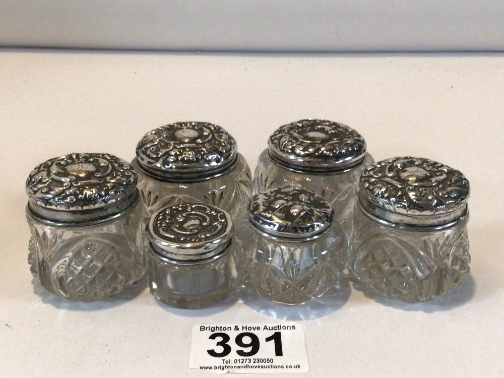 SIX HALLMARKED SILVER EMBOSSED TOP GLASS TOILET BOTTLES - Image 2 of 3