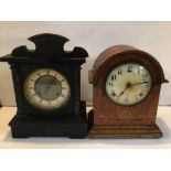 TWO VICTORIAN MANTEL CLOCKS. ONE INLAID OAK AND THE OTHER EBONISED.