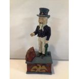 VINTAGE PAINTED CAST IRON ‘UNCLE SAM’ MECHANICAL MONEY BANK.