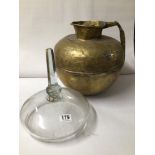 VINTAGE LEAD GLASS CLOCHE WITH LARGE RUSTIC EASTERN BRASS JUG.