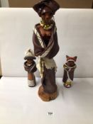 THREE SOUTH AFRICAN NDEBELE CERAMIC TRIBESWOMEN SCULPTURES. LARGEST BEING 59CM HIGH.