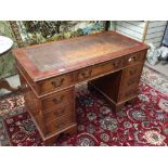 VINTAGE BROWN LEATHER TOP WRITING DESK WITH NINE DRAWERS
