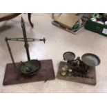 TWO VINTAGE BRASS KITCHEN SCALES, WITH WEIGHTS.