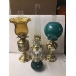 FOUR VINTAGE BRASS OIL LAMPS INCLUDING ONE ALADDIN NO. 23.