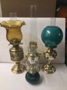 FOUR VINTAGE BRASS OIL LAMPS INCLUDING ONE ALADDIN NO. 23.