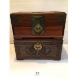 TWO ORIENTAL MAHOGANY BOXES WITH BRASS LOCKS. ONE CARVED STORAGE BOX AND THE OTHER BRASS BOUND