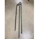 TWO GLASS WALKING CANES WITH ONE WOODEN CANE