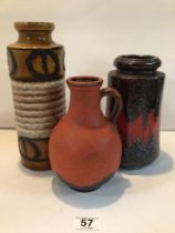 TWO WEST GERMAN STUDIO POTTERY VASES AND SIMILAR RED GLAZED EWER. THE LARGEST IS 27CM HIGH.
