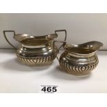 TWO HALLMARKED SILVER ITEMS A SUGAR BOWL AND MILK A JUG BY FATTORINI AND SONS, 232 GRAMS