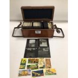 ANTIQUE BOX WITH ANTIQUE CONTINENTAL GLASS SLIDES WITH VINTAGE BROOKE BOND TEA CARDS (ADVENTURES AND