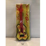 SEX PISTOLS PLASTIC TOY GUITAR IN ORIGINAL WRAPPING. FEATURING SID VICIOUS AND THREE OTHER BAND