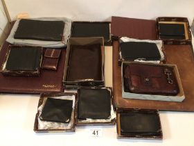 EXTENSIVE BOXED COLLECTION OF LE TANNEUR LEATHER WALLETS WITH LEATHER BINDER AND SLEEVE.