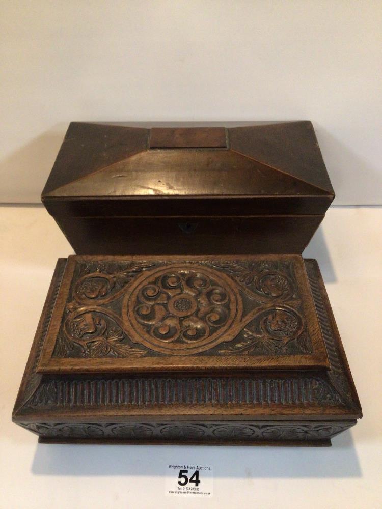 TWO VICTORIAN SARCOPHAGUS-SHAPED WOODEN BOXES. ONE CARVED WALNUT WORKBOX. THE OTHER IS A MAHOGANY