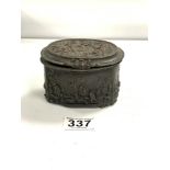 BRONZE OVAL BOX DECORATED WITH CHERUBS AND FIGURES EMBOSSED A/F, 12CM