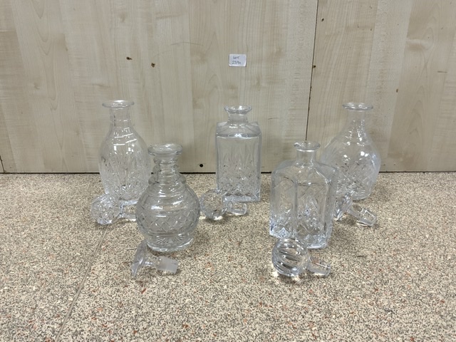 FIVE CUT GLASS DECANTERS, THE LARGEST 29CM