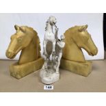 A PAIR OF VINTAGE ALABASTER HORSE HEAD BOOKENDS WITH A METAL STATUE OF A MAN REARING A HORSE.