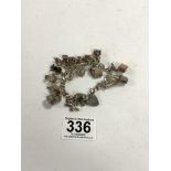 HALLMARKED SILVER CHARM BRACELET WITH SIXTEEN CHARMS, 67 GRAMS