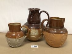 TWO MARKED DOULTON LAMBETH JUGS WITH ONE OTHER HARVEST WATER JUGS