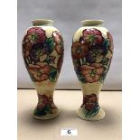 PAIR OF MOORCROFT-STYLED FLORAL DECORATED TUBE-LINED VASES. 27CM HIGH.