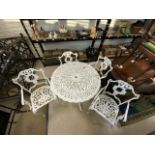 CAST IRON GARDEN TABLE WITH FOUR MATCHING CHAIRS