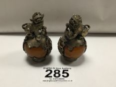 A PAIR OF WHITE METAL FOO DOGS WITH YELLOW JADE, 6