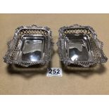 A MATCHING PAIR OF LATE VICTORIAN HALLMARKED SILVER RECTANGULAR DISHES WITH PIERCED AND CAST BORDERS