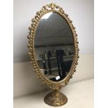 VINTAGE GILT METAL OVAL DRESSING TABLE MIRROR. 63C